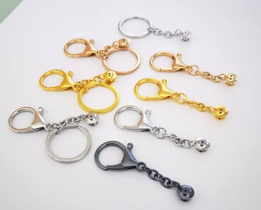 Enamel Pin-to-Keychain Adapters with different plating metal colors