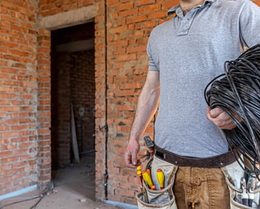 Domestic Electrician doing a house rewire in UK.