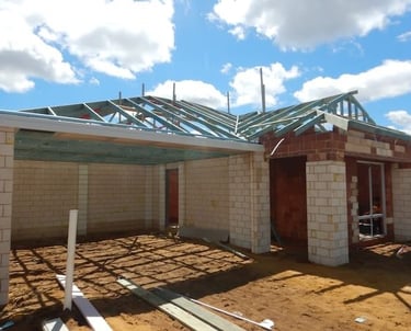 Registered Perth building inspector assessing house under construction 