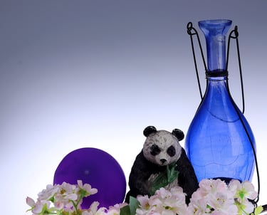 Photography of still life object with flowrs and jars