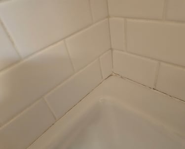 Re-caulking/Re-siliconing: Resealing around tubs
