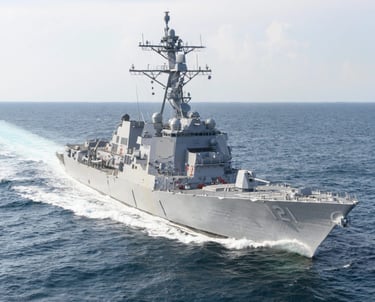 a large Navy ship in the water