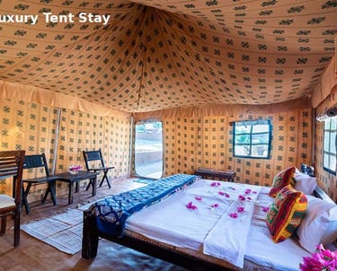 Luxury tent stay in Rishikesh with comfortable bed and traditional interior design