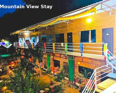 Jungle Lore Resort with mountain view rooms and beautiful night lighting