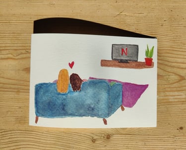 a queer greetings card of a couple on the sofa watching netflix