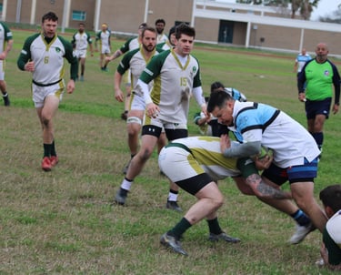 a rugby player is trying to get the ball away from the opposing teams