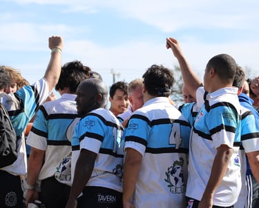 a group of people standing around a group of people