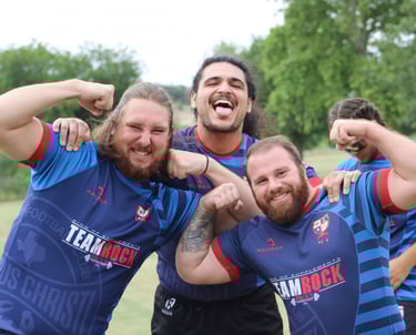 a group of men in blue and red uniforms posing for a photo