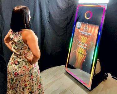 a woman standing in front of a mirror Photo Booth