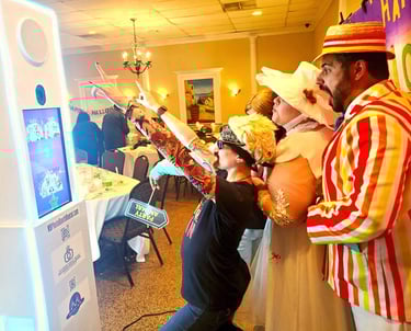 a man and woman in costumes posing in a tower photo booth