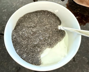 Soaked chia seeds mixed into Greek yogurt before adding toppings.