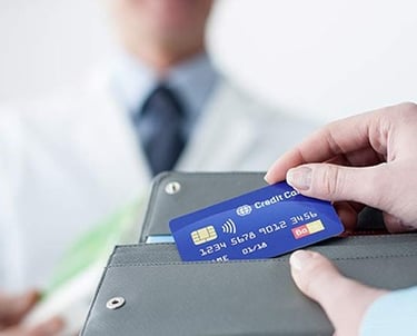 a doctor holding a credit card