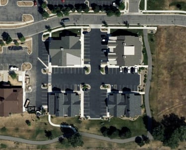 a large building with a lot of parking spaces