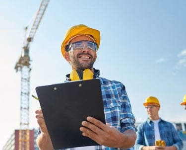 a man in a hard hat and safety vest