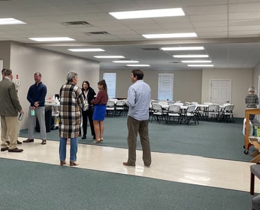 People standing and talking casually at church
