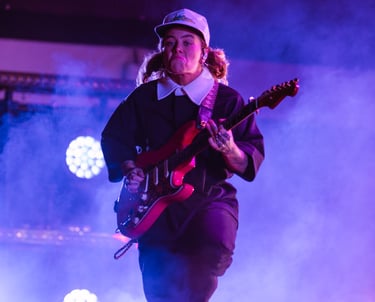 Tash Sultana rocks out on stage with their guitar at the Adelaide Vintage Vibes Festival