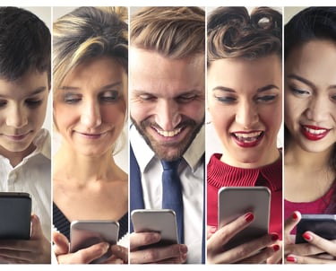 a group of people are looking at their cell phones