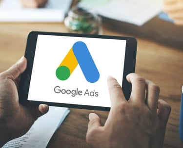 a person holding a tablet with google ads