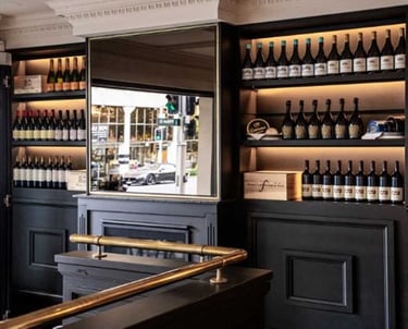a bar with a bar counter and a bar with a bar stool