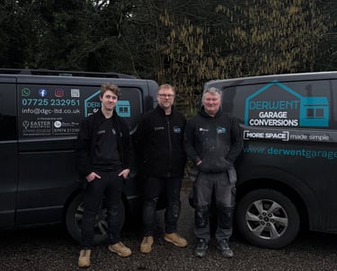 Nathan Easter, Simon Easter and Simon Hamp in front of work vans