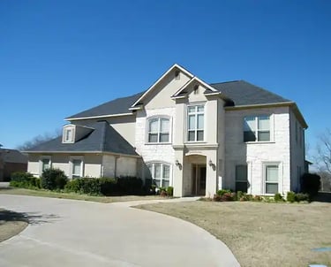 a house with a driveway and driveway with a driveway