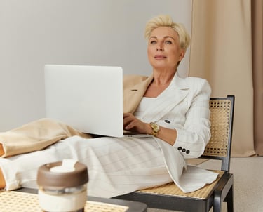 Professional reading iG101 weekly fitness newsletter with morning coffee