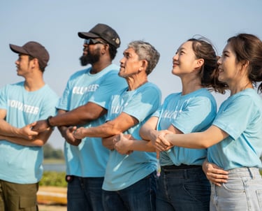 a nonprofit group of people standing in a line holding hands