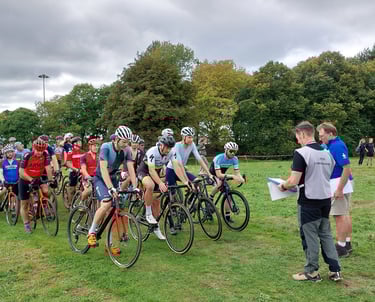 cyclists lined up at the start of a cyclocross race