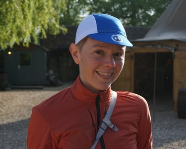A portrait of Liz Hughes, smiling on a sunny day.