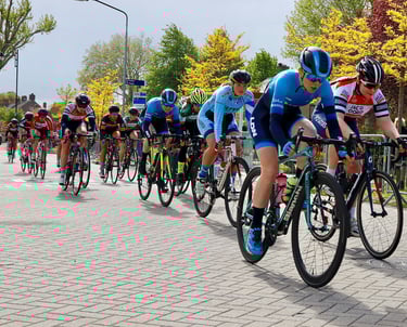 A road bike race with Liz Hughes at the front of the women's peloton