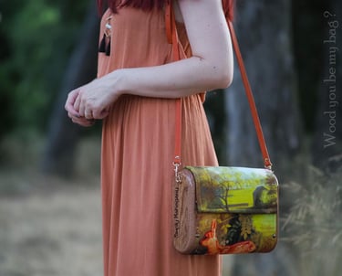 a woman holding mahogany wooden bag with Bambi image