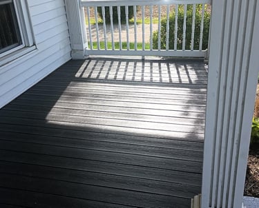 An old porch was transformed with composite decking in Ligonier, IN (completed transformation).