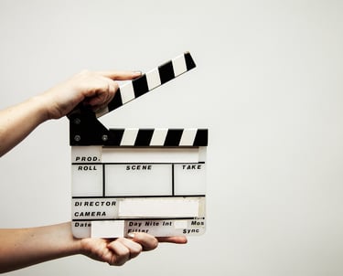 a person holding a clapper board