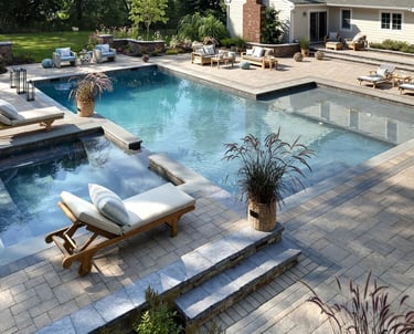 Custom Luxury Outdoor Pool and Patio with attached spa, custom masonry, and bespoke landscape design