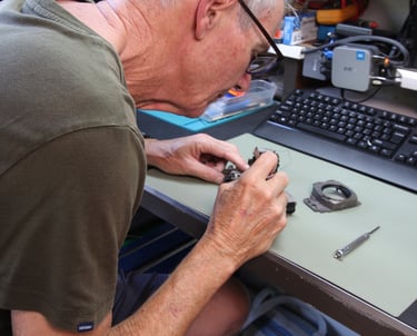 Camera technician repairing Nikon camera