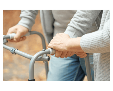 a woman holding a walker frame in her hands