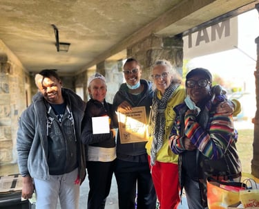 Volunteers taking a picture together in the fridge & pantry area. 