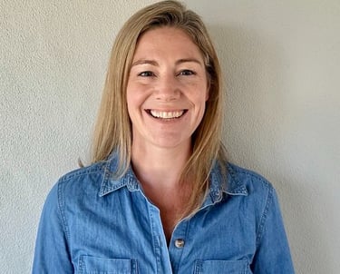 a woman in a denim shirt and jeans jacket