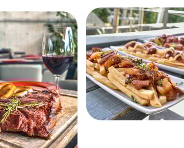 Grilled T-bone steak on a wooden board served with red wine and loaded gourmet fries.