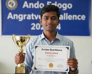 A South Asian student proudly holding a trophy and certificate in front of a blue school banner, highlighting academic excellence and success in a clean, professional setting.