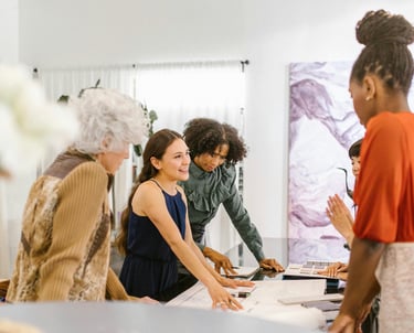 Team discussing ideas around a table in a meeting room