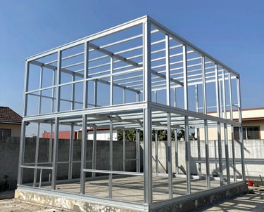 Photo of a cozy renovated home exterior with rustic countryside surroundings.