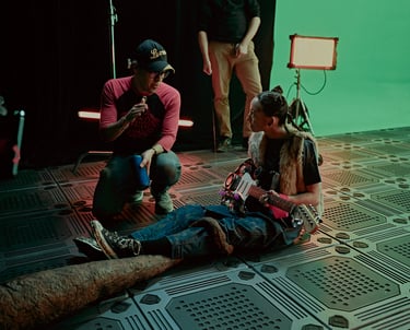 Director Javier Badillo speaks with actress Sofia Skates during the filming of a scene