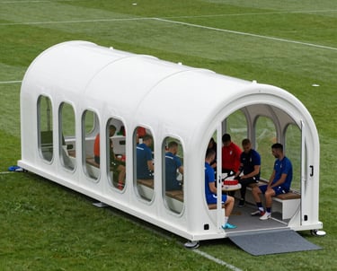 A sleek hyperbaric oxygen chamber set up inside a mobile clinic van with bright, clean lighting.