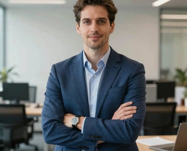A professional portrait of a brand strategist in an office setting. They are wearing professional clothing in shades of blue. The background is a clean, modern workspace in North America.