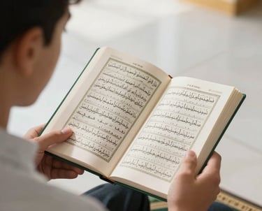 A close-up of a student respectfully reading a digital text, in a brightly lit, modern environment with soft white and gold lighting, symbolizing the Quran & Tajweed program.