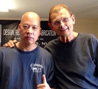Ray and Tom Mullica posing together in a fabrication shop, featuring KMD Kustom magic design