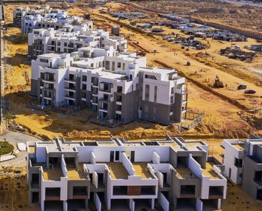 alt="Palm Hills Egypt construction progress showing apartment buildings under development"