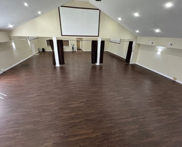 Empty open layout event space in Atlanta with hardwood floors