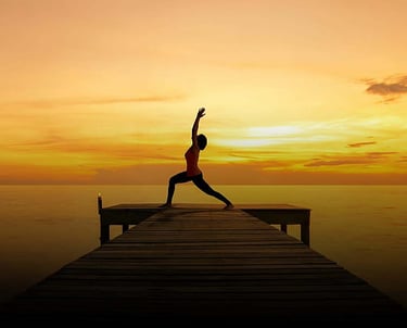 Stock photo of yoga students moving through a Vinyasa flow sequence